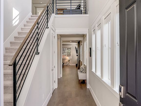 Hardwood Floors Throughout Most Of The Main Floors. Extra Tall Ceilings And Large Windows Make This Home Light And Bright!