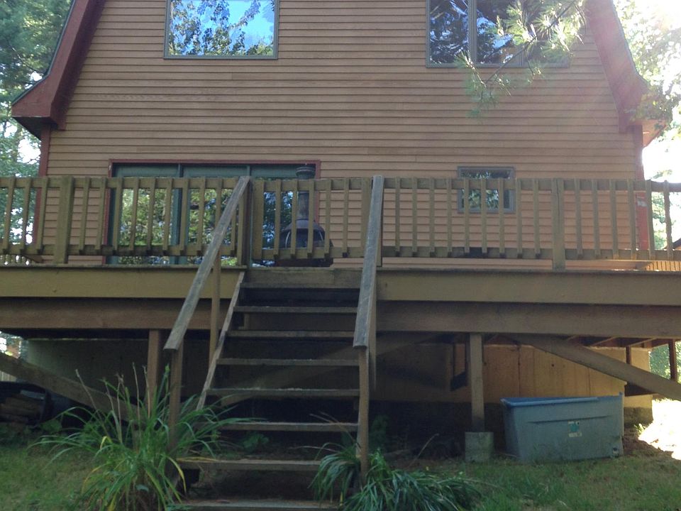 Front of house faces farm pond.