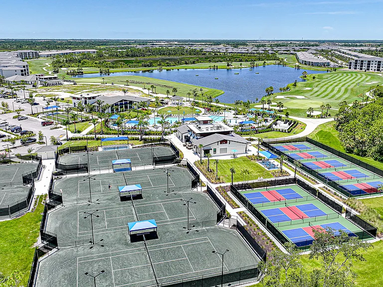Tennis, Pickleball, Workout facility, Pro Shop, Tiki Bar short walk with the unit in background.
