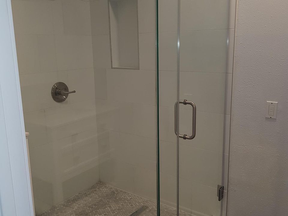 Frameless glass enclosed shower