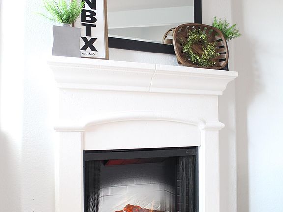 The electric fireplace is a safe and beautiful way to add some ambiance to the living room