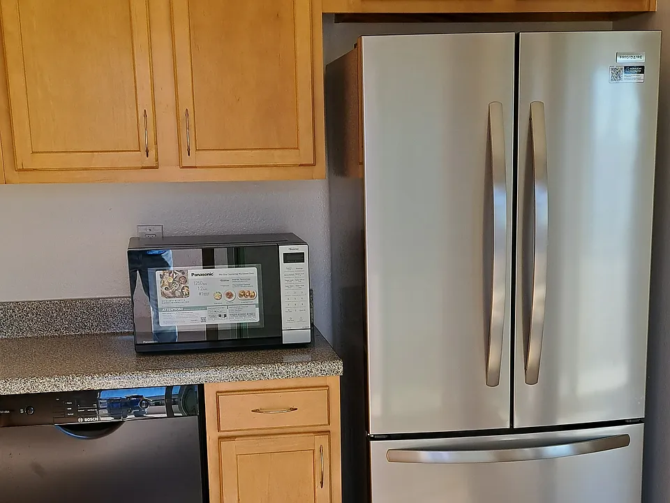 New Refrigerator with bottom Freezer and Icemaker. New Microwave. Bosch Dishwasher