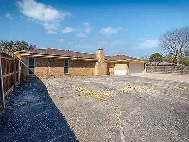 alley access to garage and large parking pad for whatever you have