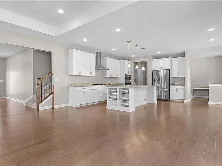 Open concept first floor with hardwood floors.