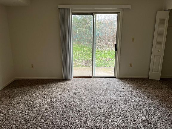 Bedroom with access to concrete patio