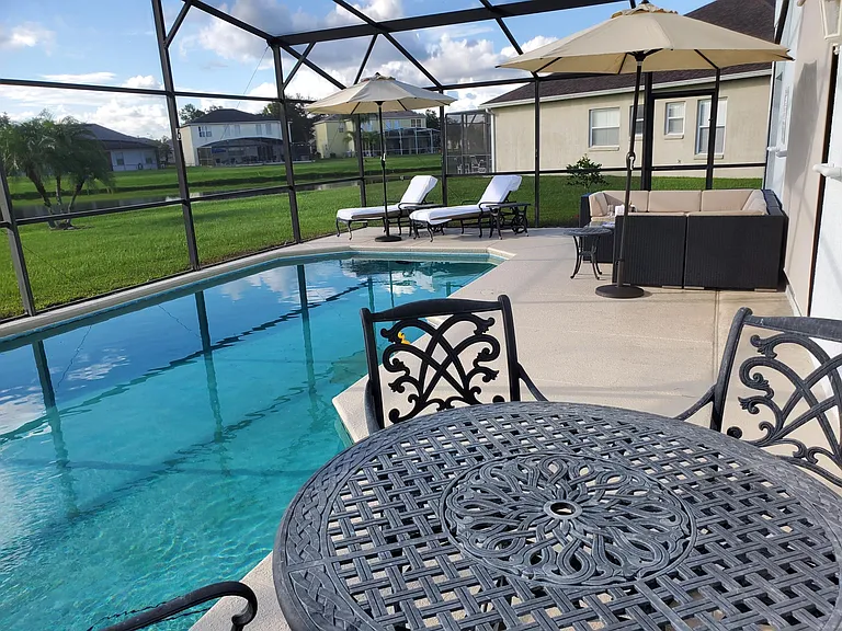 Big deck for plenty of fun. Safety first! Wrought iron furniture and umbrellas included along with Jenn-air gas grill, which is stored in garage.
