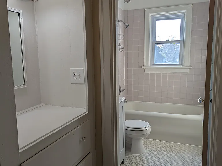 Spacious full bathroom with built ins