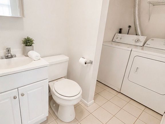 Half Bath and Laundry Room. Full-sized washer & dryer in every unit!