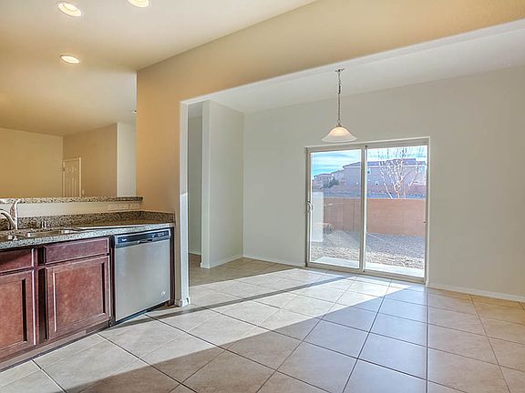 The kitchen flows into the dining area with beautiful archway detailing