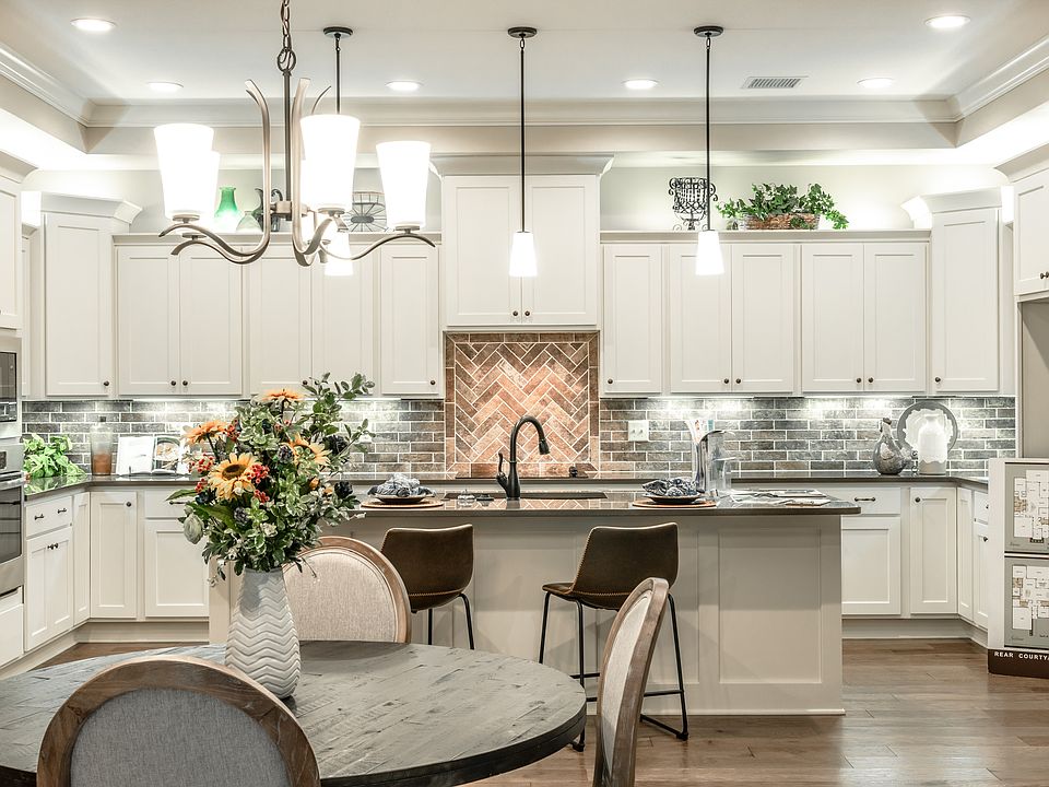 Homes feature gourmet kitchens.