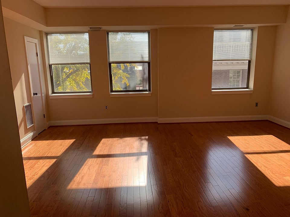The apartment has three sun-filled windows overlooking quiet Corcoran Street.