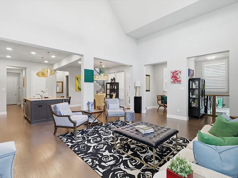 Open Concept living with natural light, custom lighting and window coverings
