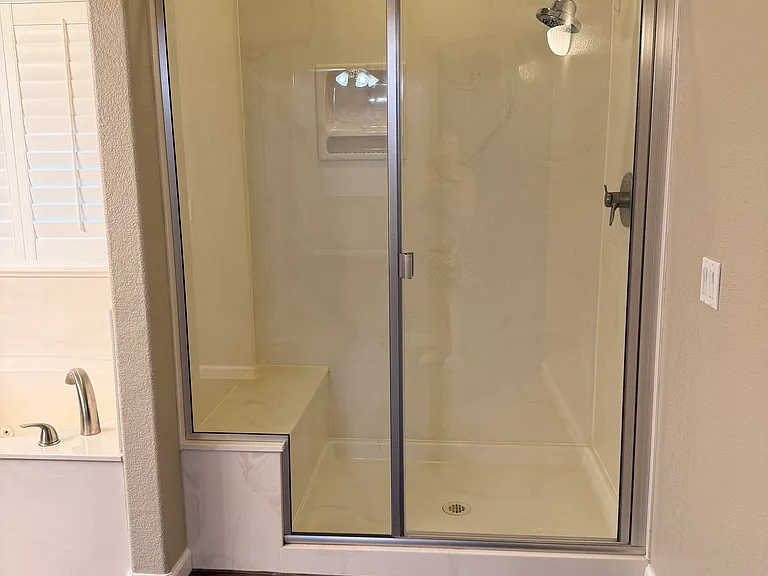 Master bathroom; large walk-in shower with seat