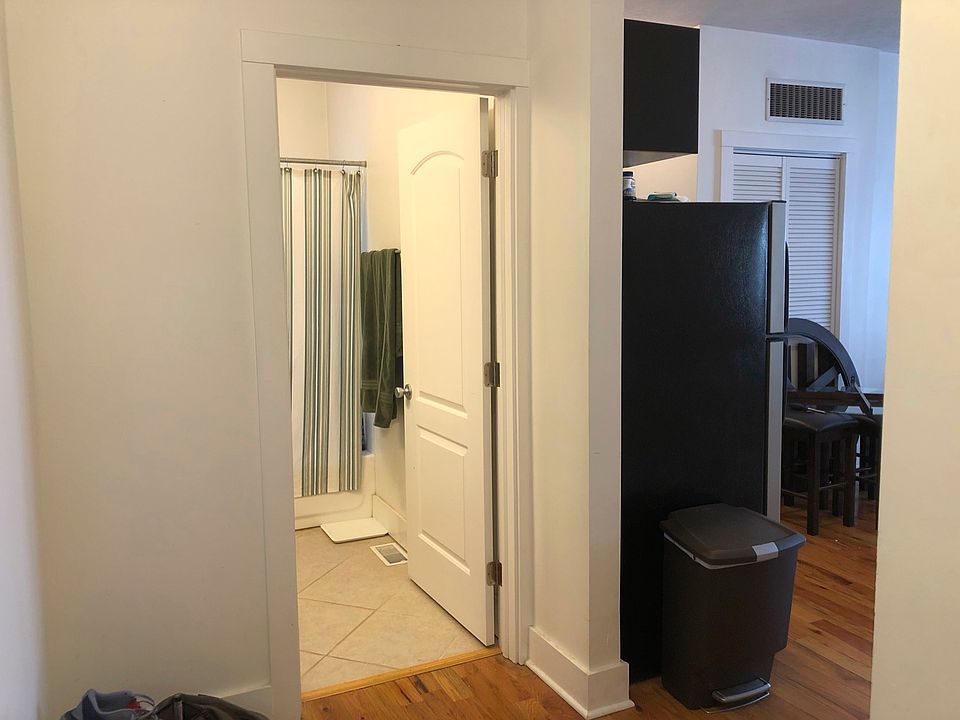 Full bathroom and coat closet inside the entry to your unit