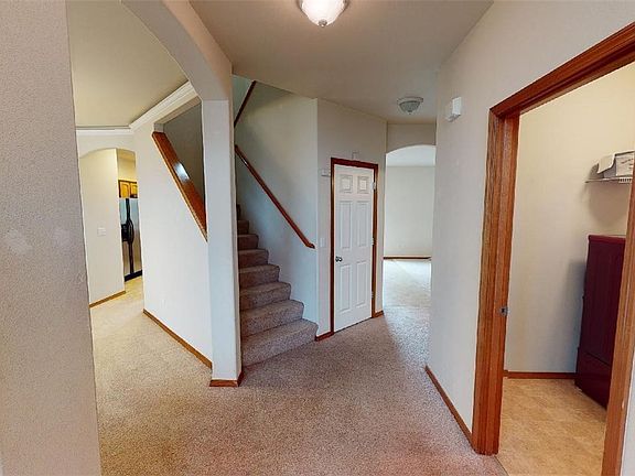 Another view as you come in the front door (Laundry area to the right). Coat closet to the right of stairs is HUGE- room for much more than just coats.