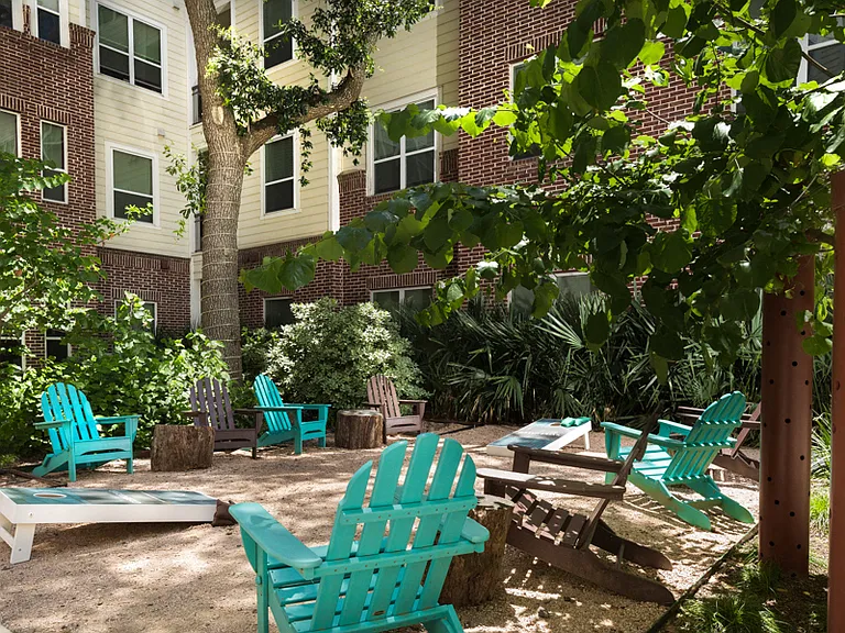 Sandy, courtyard lounge with corn hole and beach games