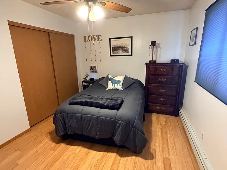 Second upstairs bedroom with full bed and dresser