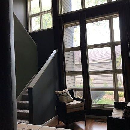 vaulted ceiling, fireplace with ceramic top. Sitting/living