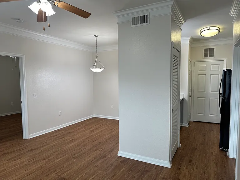 Modern apartment interior with sleek wood-style flooring, elegant ceiling fan, and ambient lighting. Ready for customization. Modern apartment interior with sleek wood-style flooring, elegant ceiling fan, and ambient lighting. Ready for customization.
