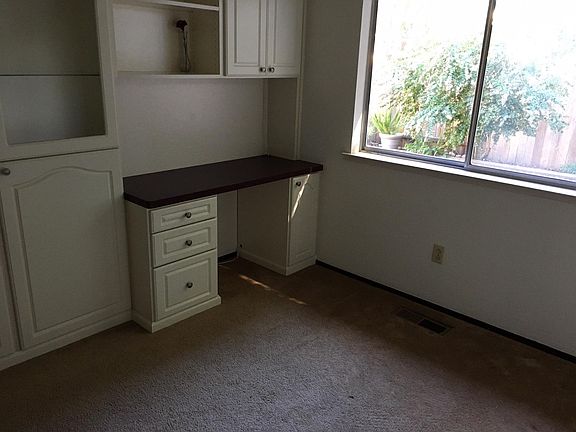 Bedroom #2 with built-in wall unit