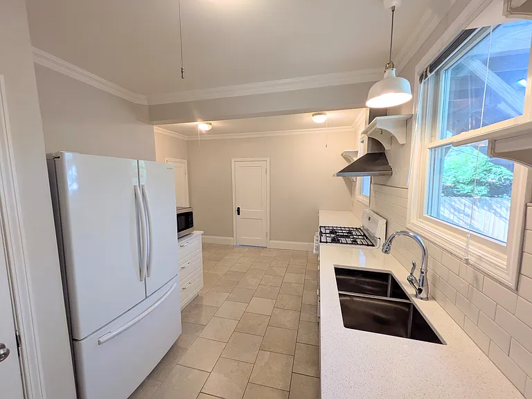 View from side of kitchen towards second bedroom