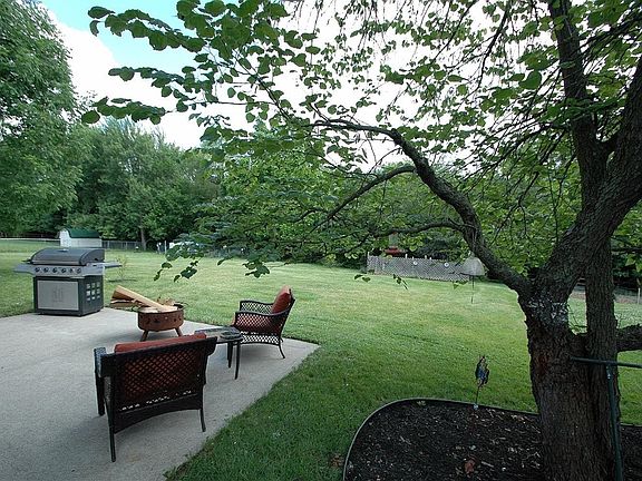Peaceful setting in tree lined back yard. Perfect for cook outs.