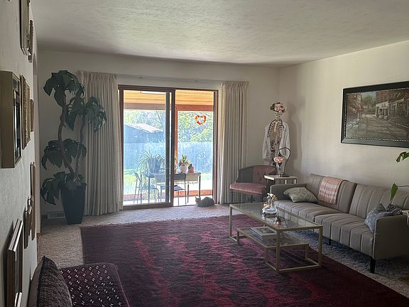 Living room with sunroom in the back
