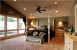 Master Bedroom overlooking walls of glass to a private courtyard.