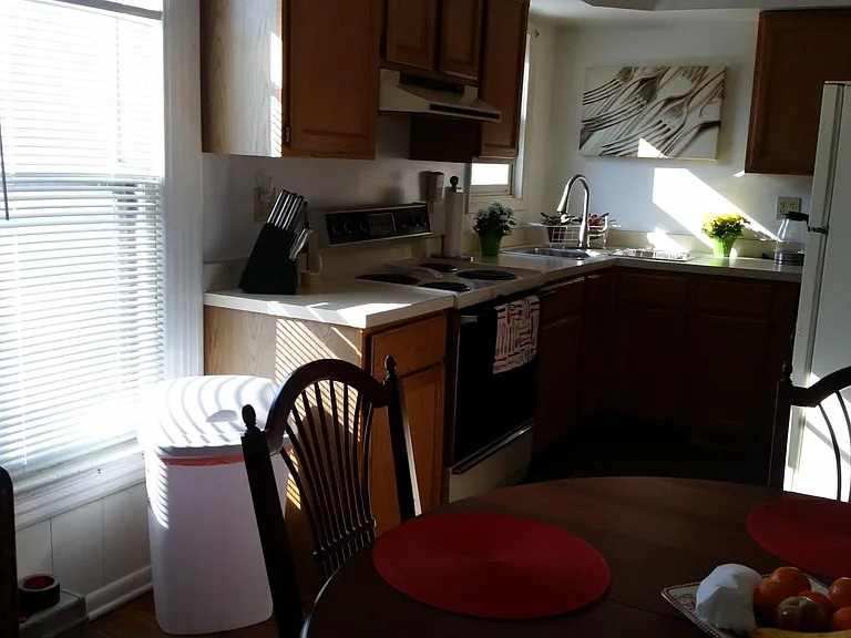 Sunny kitchen overlooking back yard. Fully stocked to relax