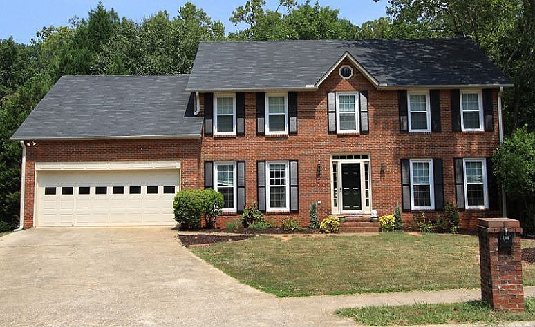 Beautifully renovated home in Weatherstone with level driveway & 2 car garage.