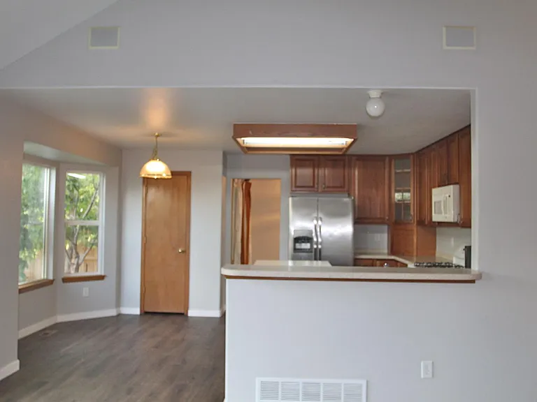 Kitchen has stone countertops, pantry, and breakfast nook
