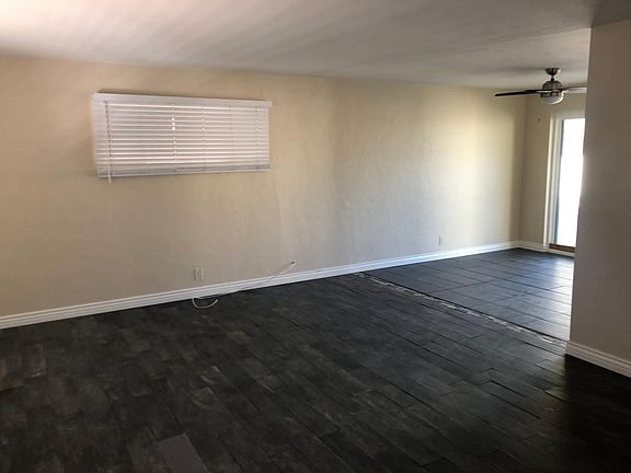 Living Room look at Dining Room and sliding back door.