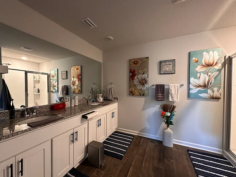 Master bedroom with a double sink master bath.