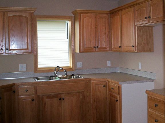 custom oak cabinetry, hardwood floors