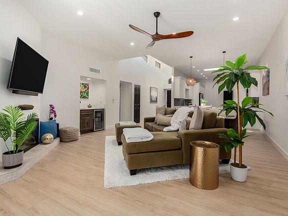 Open living concept: All new interior paint, lighting, ceiling fans, wood plank tile flooring!