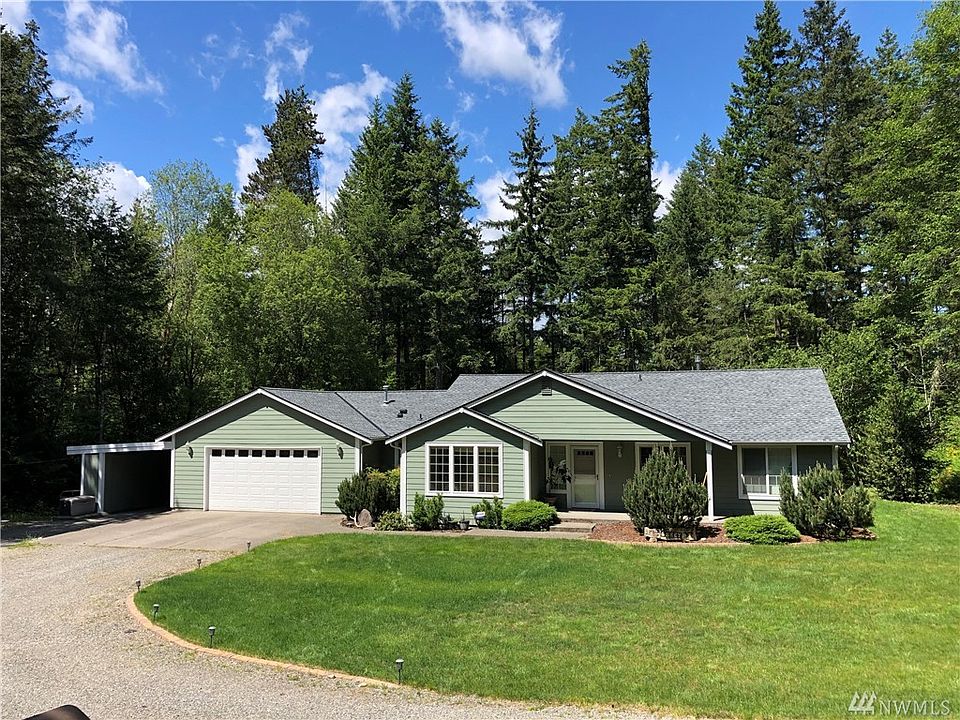 Exquisite large rambler, 4 bedrooms 2.5 baths and over 2300 Sq Ft. 2 Car garage and large carport attached. Inside the carport is 5 different storage areas. You can also see the Generator on the left, hardwired and on demand useage. To the left of the carport is also the Heat Pump for the Propane Furnace, high efficiency!