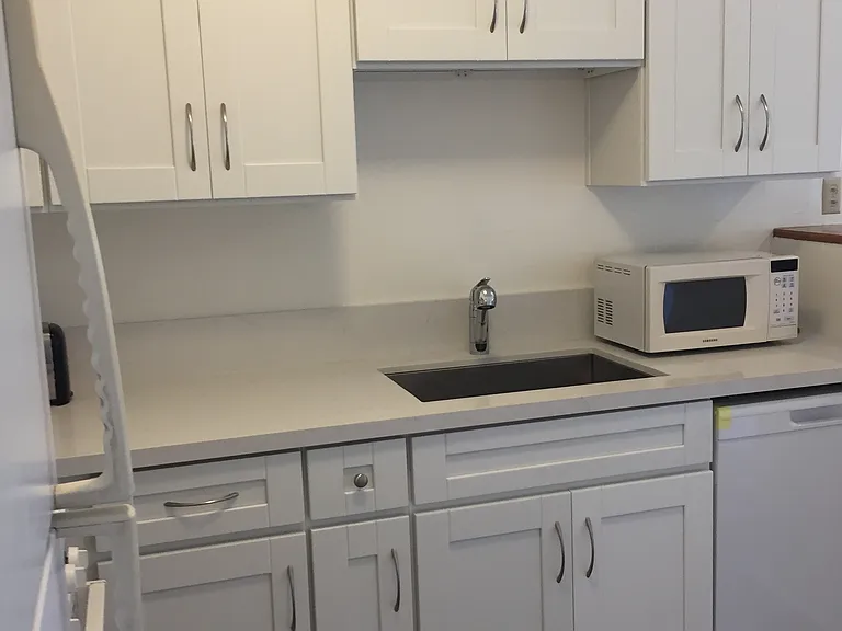 Kitchen has dishwasher, gas stove, refrigerator