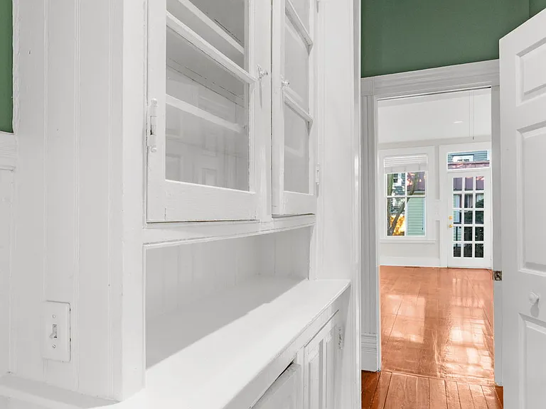 Hallway from Entry into Living Room & Kitchen with Built-In Cabinets