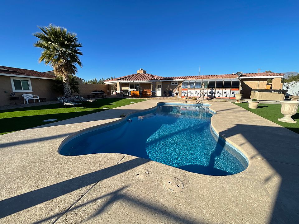 Large inviting pool and a deluxe hottub.
