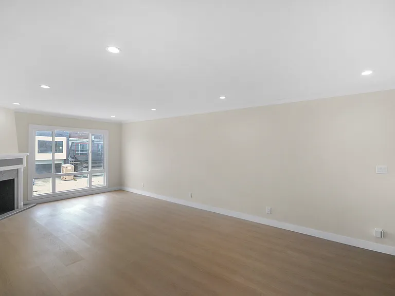 Wall of windows with fireplace