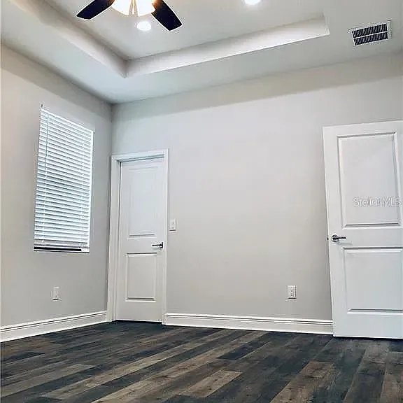 Primary Suite with Tray Ceilings & Walk-In Closet