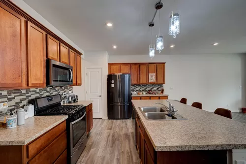 Kitchen with all black stainless steel appliance package - 469 Watercress Dr