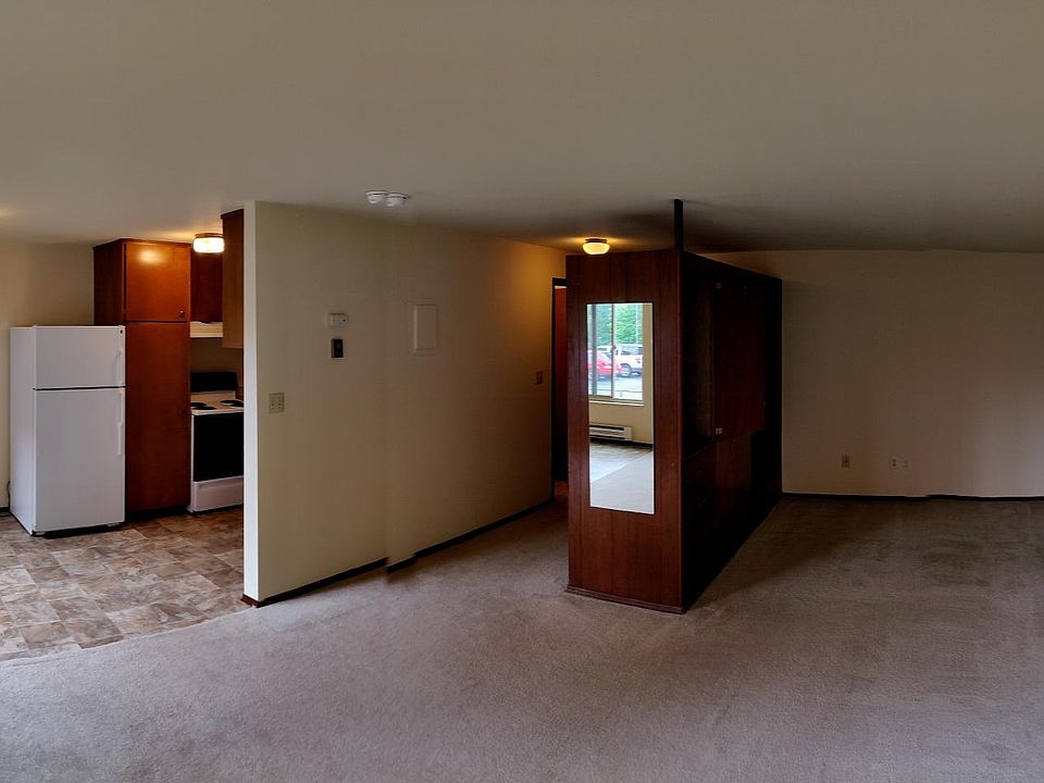 Panorama view of kitchen, living space & bed area. New carpet, padding and fresh paint.