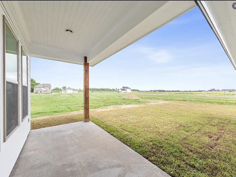 Enjoy relaxing on the covered patio overlooking the fully fenced backyard, offering added privacy and the perfect space for outdoor dining, entertaining, or simply unwinding.