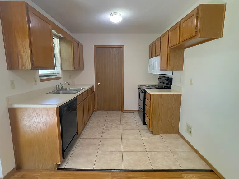 Kitchen with closed Laundry Rm door at back
