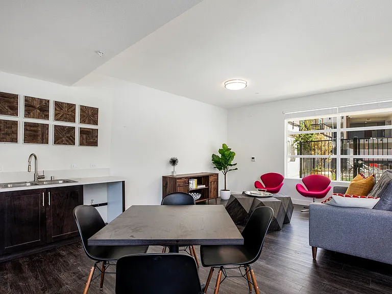 The Harrington dining room table and furnished living room