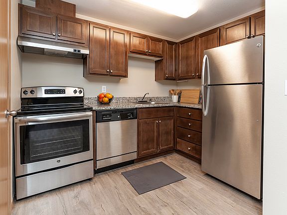 Experience the chic elegance of this modern kitchen, designed for culinary excellence.