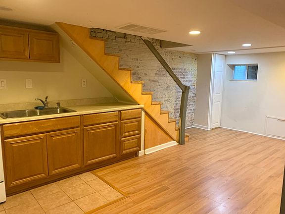 Kitchenette and living room space .