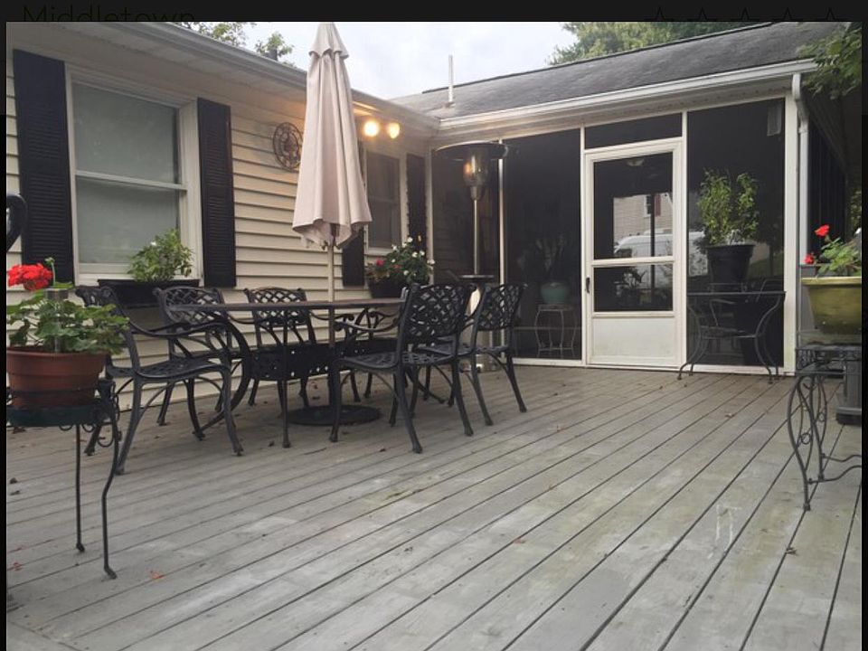 Deck and screened sunroom. Shades drawn for your privacy. House, walks,? and deck power washed 9/2
