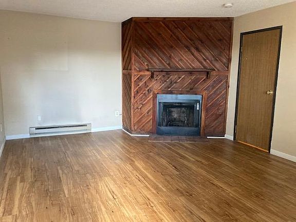 Living room with wood burning fireplace